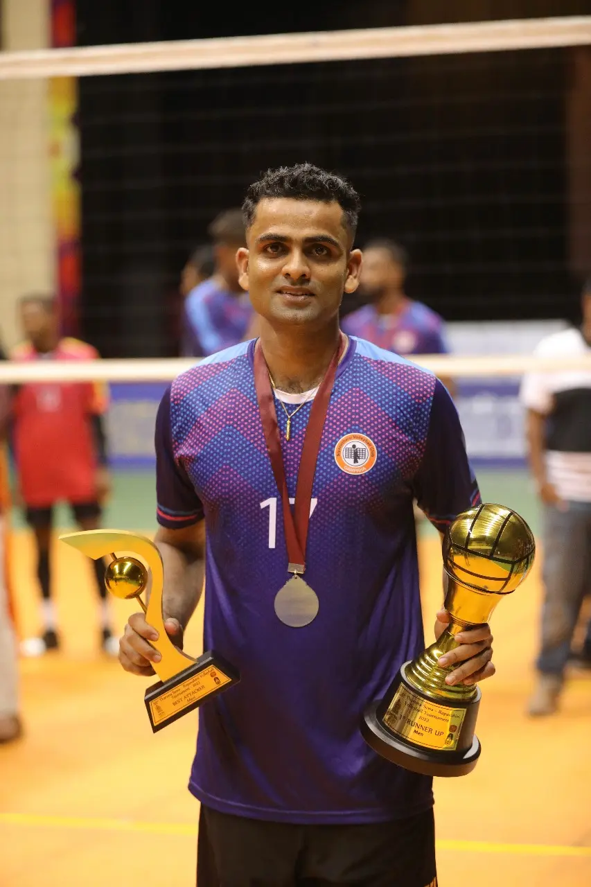 Isuru receiving an award on stage