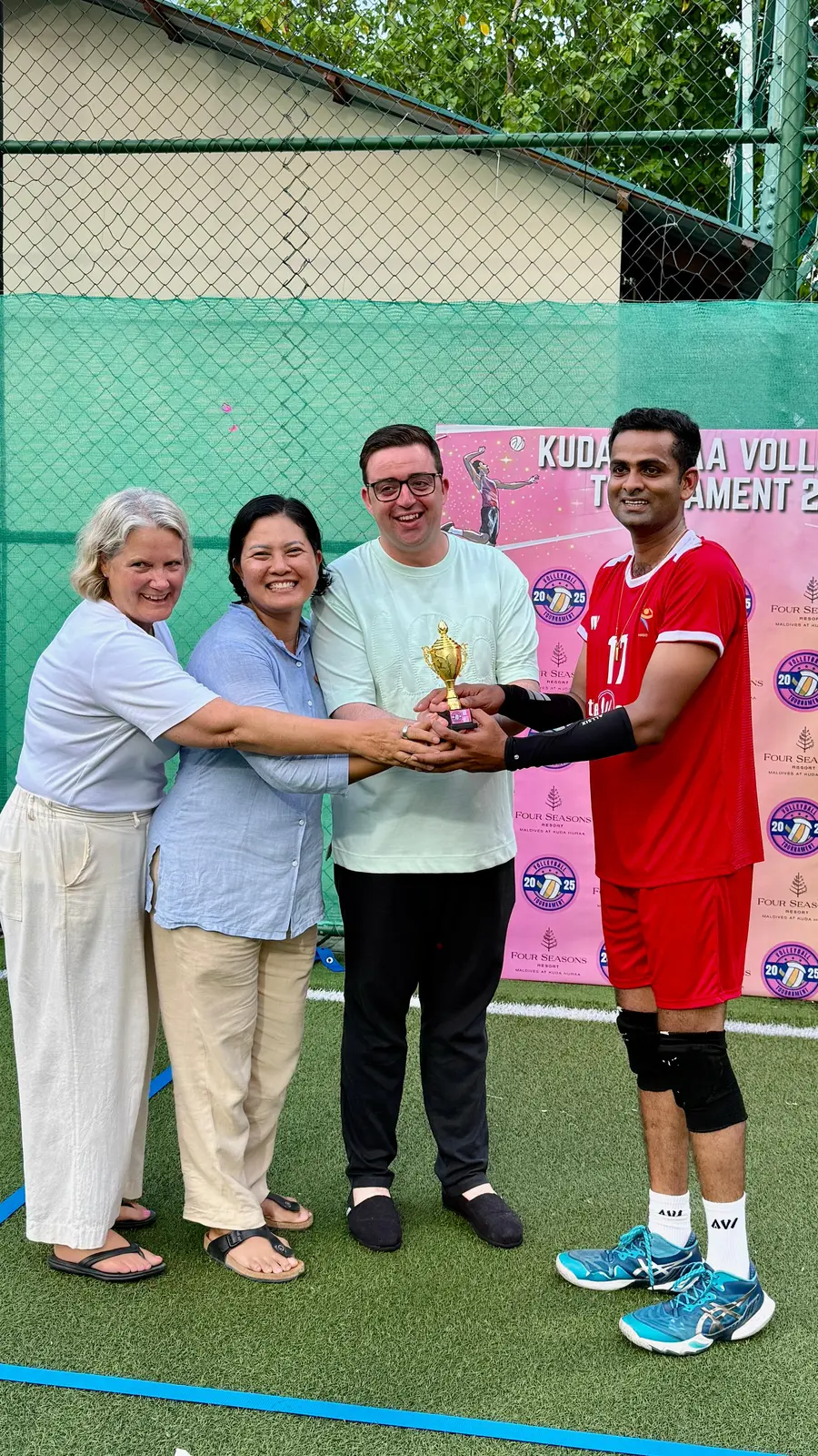 Isuru receiving a resort volleyball award