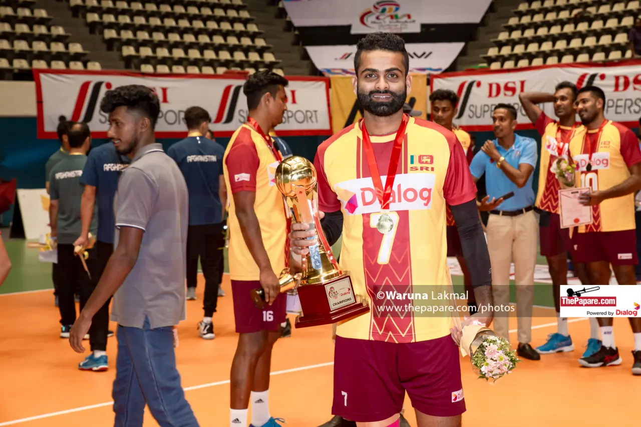 Isuru Madhushan holding the Central Asian championship trophy