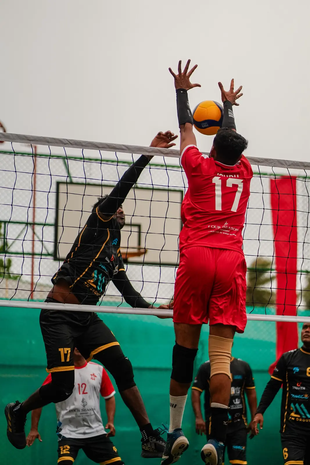 Isuru attacking during a resort volleyball match
